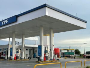 an empty gas station with a sky background